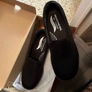 Skechers black slip on arch fit shoe